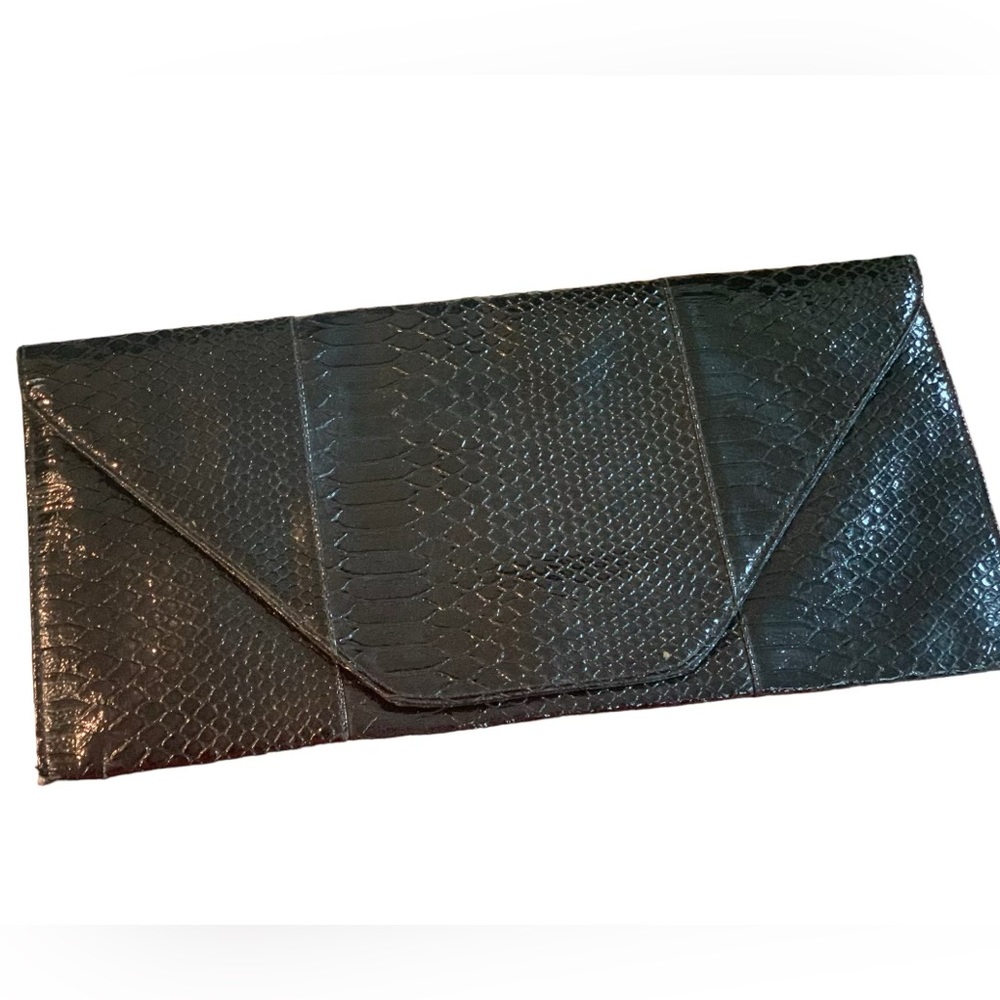 Shiny black crocodile clutch
